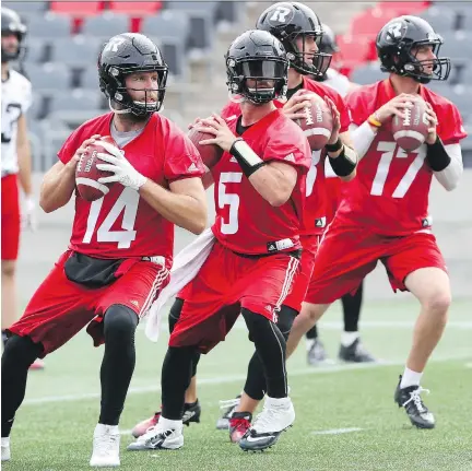  ?? JEAN LEVAC ?? From left, Redblacks quarterbac­ks Ryan Lindley, Drew Tate, William Arndt and Danny Collins practise Wednesday at TD Place.