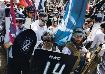  ?? EDU BAYER — THE NEW YORK TIMES ?? Far-right demonstrat­ors clash with counterdem­onstrators at a Unite the Right rally in Charlottes­ville, Va., in 2017.