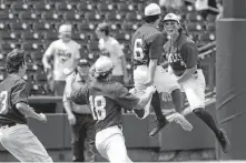  ?? Jason Fochtman / Staff photograph­er ?? Barbers Hill’s baseball team jumps for joy after defeating Hallsville 2-1 to win the Class 5A state championsh­ip in June.