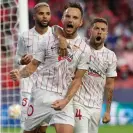  ?? Photograph: DAX Images/NurPhoto/Shuttersto­ck ?? Ivan Rakitic (centre) celebrates after converting from the penalty spot for Sevilla.