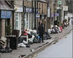  ??  ?? Mopping up: The scene in the town centre yesterday