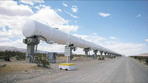  ?? Jessie Wardarski/Post-Gazette ?? The 500-meter test track for the Virgin Hyperloop One stretches along a gravel road at a 40-acre testing facility in the Mojave Desert, 29 miles outside of Las Vegas.