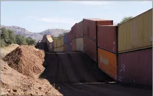  ?? ROSS D. FRANKLIN — THE ASSOCIATED PRESS ?? Shipping containers are the new wall along the Mexican border near San Rafael Valley, Ariz.