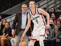  ?? Jessica Hill / Associated Press ?? Coach Geno Auriemma is 11-0 in NCAA title games, a record Paige Bueckers, right, will try to improve to 12-0 on Sunday.