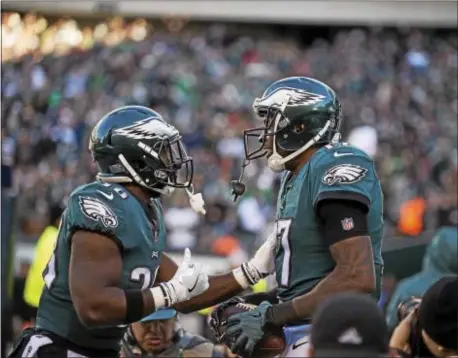  ?? RICK KAUFFMAN - DIGITAL FIRST MEDIA ?? Eagles receiver Alshon Jeffrey, right, celebrates a touchdown reception with teammate Kenjon Barner.