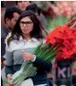  ?? AP ?? A woman buys flowers at a market to celebrate Valentine’s Day in Islamabad on Tuesday. —