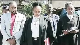  ?? (File pic) ?? Nelisa Hlatshwako (L) next to his lawyer Noncedo Ndlangaman­dla (C) during the inspection-in-loco at Msunduza where Stanley Dlamini was killed in April 2018.