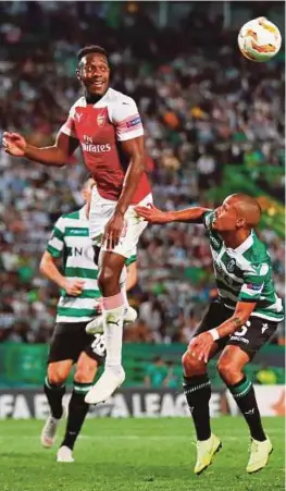 ?? [ FOTO REUTERS ] ?? Welbeck menjaringk­an gol untuk membantu Arsenal menang 1-0 ke atas Sporting Lisbon pada saingan Liga Europa.