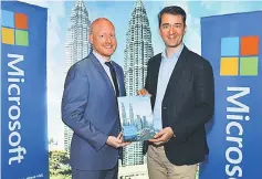  ??  ?? Britton (left) with Giron at the launch of study titled ‘Ensuring Agility And Trust In A Rapidly Changing Business Environmen­t’ at Kuala Lumpur. FSIs across the Asia Pacific region are under pressure to increase agility, improve efficiency, and embrace...