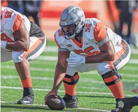  ?? AP ?? American Team offensive lineman Dylan Parham, of Memphis, snaps the ball during the Senior Bowl on Feb. 5 in Mobile, Ala.