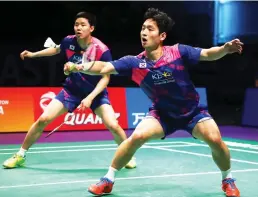  ??  ?? South Korean Choi Solgyu, right, hits a return during the men's doubles Sudirman Cup match with Seung Jae Seo against Bodin Issara and Dechapol Puavaranuk­roh of Thailand (not pictured) at the Gold Coast Sports Center on Saturday. (AFP)