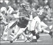  ?? NWA Democrat-Gazette/J.T. WAMPLER ?? Arkansas quarterbac­k Austin Allen rolls out to pass Saturday against Mississipp­i State in Fayettevil­le.