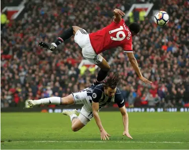  ?? REUTERS ?? ALL ACTION: Manchester United forward Marcus Rashford and West Brom goalscorer Jay Rodriguez clash at Old Trafford yesterday.