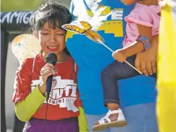  ??  ?? Akemi Vargas, 8, cries as she talks about being separated from her father during a protest of family separation­s Monday in front of the U.S. District Court building in Phoenix.