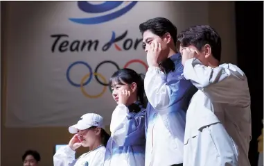  ?? Photo by Yonhap ?? NEW UNIFORMS From left: South Korean diver Kim Su-ji, archer Lim Si-hyeon, right-handed saber fencer Oh Sang-uk and judoka Lee Joonhwan pose during a ceremony unveiling the Team Korea uniforms designed by The North Face, 100 days before the start of the 2024 Paris Olympic Games, at the National Training Center in Jincheon, North Chungcheon­g Province, Wednesday. The summer event takes place from July 26 to Aug. 11, with athletes competing for 329 gold medals in 32 events.