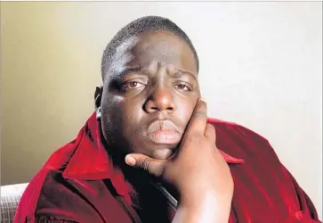  ?? Lori Shepler Los Angeles Times ?? CHRISTOPHE­R WALLACE, who used the stage names Notorious B.I.G. and Biggie Smalls, was killed in a drive-by shooting in L.A. 20 years ago. The case remains unsolved, but it has spawned numerous theories.