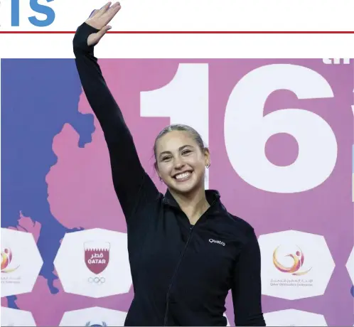  ?? LeVi Jung-Ruivivar waves to the crowd following her routine in the 2024 World Cup Series in Doha, Qatar. ??