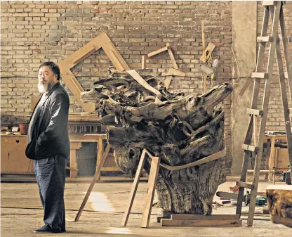  ??  ?? Ai Weiwei, the artist, with one of his trademark works. Left, an Asian longhorned beetle