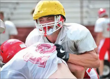  ?? PHOTOS BY WILLIAM HARVEY/THREE RIVERS EDITION ?? Heber Springs senior Chris Hart tackles junior Zach Rodgers during a practice earlier this summer.