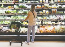  ?? GETTY IMAGES FILES ?? A poll found 53 per cent of Canadian respondent­s plan some form of changes to their food shopping habits.