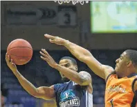  ?? JASON MALLOY/THE GUARDIAN ?? Island Storm guard Chris Johnson, right, tries to block or alter Halifax Hurricanes point guard Cliff Clinkscale shot during Saturday’s Game 4 at the Eastlink Centre.