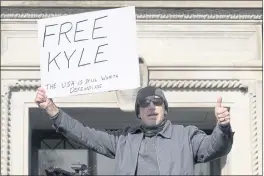  ?? PAUL SANCYA — AP PHOTO ?? A supporter of Kyle Rittenhous­e reacts to Rittenhous­e’s verdict outside the Kenosha County Courthouse on Friday in Kenosha, Wis.