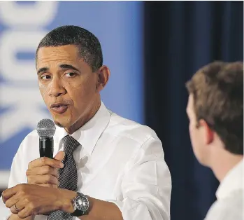  ?? JUSTIN SULLIVAN/GETTY IMAGES ?? Then-U.S. President Barack Obama talks with Facebook CEO Mark Zuckerberg during a town-hall meeting at Facebook headquarte­rs in April 2011 in Palo Alto, Calif. Obama met with Zuckerberg last year to warn of the dangers of Facebook being used to spread fake news and political disinforma­tion.