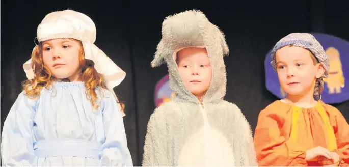  ??  ?? Festive friends Pictured from left are Isla Rowell, Mya Cluckie and Myles McCrossin