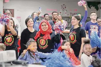  ?? Photos by Michael Wyke/Contributo­r ?? Burchett Elementary students and staff celebrate Monday morning as their Spring ISD school advances into the Sweet 16 bracket in the Read to the Final Four program.