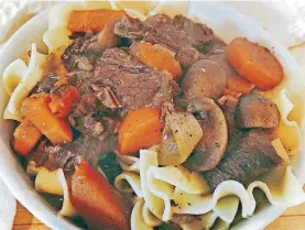  ?? [PHOTO BY ELIZABETH KARMEL, AP] ?? Burgundy beef stew made with an electric pressure can be served over egg noodles, mashed potatoes or gnocchi for a satisfying cold-weather meal.