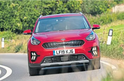  ??  ?? The Kia Niro non-plug-in hybrid can cover short distances on electric power alone.