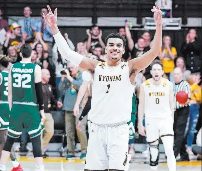  ?? Troy Babbitt Wyoming Media-athletics ?? Wyoming Cowboys guard Justin James celebrates a home victory over Colorado State on Feb. 9.