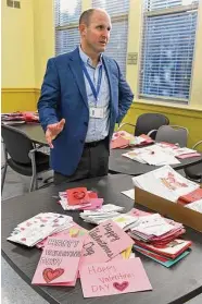  ?? ?? Superinten­dent of Schools Martin Semmel stands next to a table full of Valentine’s Day cards as he speaks during an interview at the Trumbull Senior Center, in Trumbull, Feb. 10.