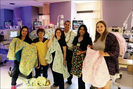  ?? LOANED PHOTO ?? LOCAL TEEN JORDAN CORDERY (far right) donates 20 hand-sewn incubator covers to the Yuma Regional Medical Center Neonatal Intensive Care Unit (NICU).