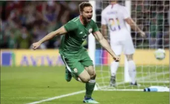  ?? BRIAN LAWLESS — PA VIA AP ?? Ireland’s Alan Judge celebrates after scoring the game-winning goal against the U.S. in Dublin on Saturday.