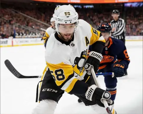  ?? Associated Press ?? The stroke Kris Letang suffered in 2014 places the pre-existing conditions label on him. Said Letang — “I had my fair share of questions. They’ve all been answered.”