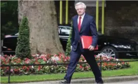  ?? — AFP ?? LONDON: Britain’s Secretary of State for Exiting the European Union (Brexit Minister) David Davis arrives to attend a Cabinet meeting at 10 Downing Street.