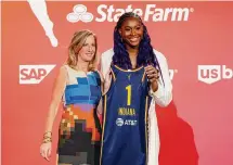  ?? Sarah Stier/Getty Images ?? WNBA Commission­er Cathy Engelbert and Aliyah Boston pose for photos after Boston was drafted 1st overall by the Indiana Fever during the 2023 WNBA Draft at Spring Studios on April 10 in New York City.