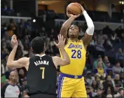  ?? BRANDON DILL — THE ASSOCIATED PRESS ?? The Lakers’ Rui Hachimura, who scored 32 points, shoots over the Grizzlies’ Santi Aldama in Wednesday’s game.