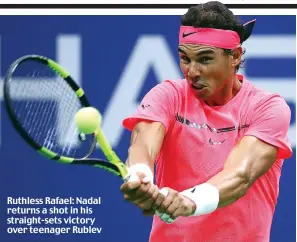  ??  ?? Ruthless Rafael: Nadal returns a shot in his straight-sets victory over teenager Rublev