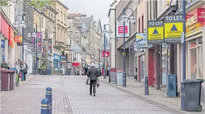  ?? Picture: Steve Brown. ?? A quiet Dunfermlin­e town centre. The Scottish Retail Consortium says the proposed rates change won’t reignite high streets.