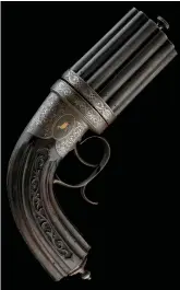  ?? ?? This highly decorated, 120-bore, percussion, 18-barrelled pepperbox revolver, circa 1845, sold at Holts, is perhaps best kept in its box