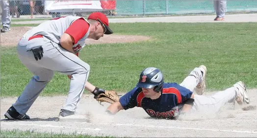  ?? TELEGRAM FILE PHOTO/JOE GIBBONS ?? In this 201 file photo, St. John’s Capitals first-baseman Andrew Symonds applies a tag to the Corner Brook Barons’ A.J. Whiffen as Whiffen dives safely back to first on a pick-off attempt during Game 1 of the best-of-seven provincial senior A baseball...