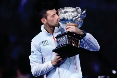  ?? (Getty) ?? NovakDjoko­viccr ad lest he Australian Open trophy that herald s his return to No 1