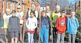  ?? ?? Planted Riverside Primary youngsters and Stirling Rotary Club youngsters with cherry trees commemorat­ing the Queen’s Platinum Jubilee