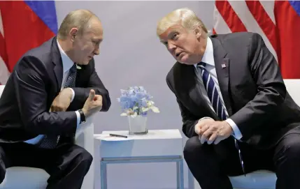  ??  ?? US President Donald Trump, right, and his Russian counterpar­t Vladimir Putin.