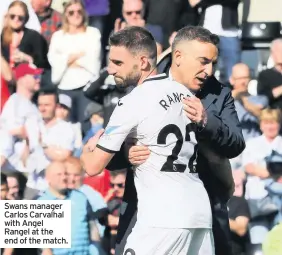  ??  ?? Swans manager Carlos Carvalhal with Angel Rangel at the end of the match.