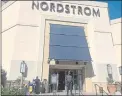  ?? EUGENE GARCIA — ASSOCIATED PRESS ?? A security guard stands outside the Nordstrom store at The Grove retail and entertainm­ent complex in Los Angeles on Nov. 23.