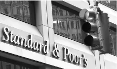  ?? — Reuters photo ?? Standard & Poor’s raised Argentina’s credit rating one notch, from B- to B, saying Latin America’s third-largest economy was on the verge of exiting recession.