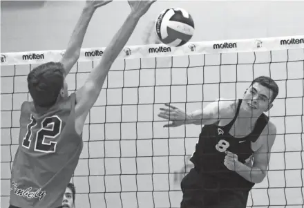  ??  ?? Germantown’s Luke Taylor puts home a kill against Kimberly in the state boys volleyball final.